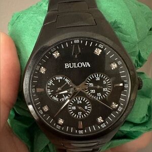 Bulova Watch black with diamond accent in face.